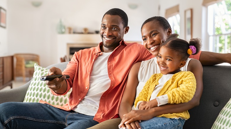 african american family watching TV