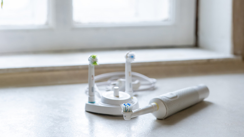 An electric toothbrush with spare heads and charger