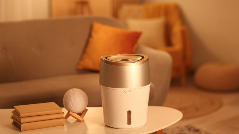 A humidifier on coffee table in living room at evening
