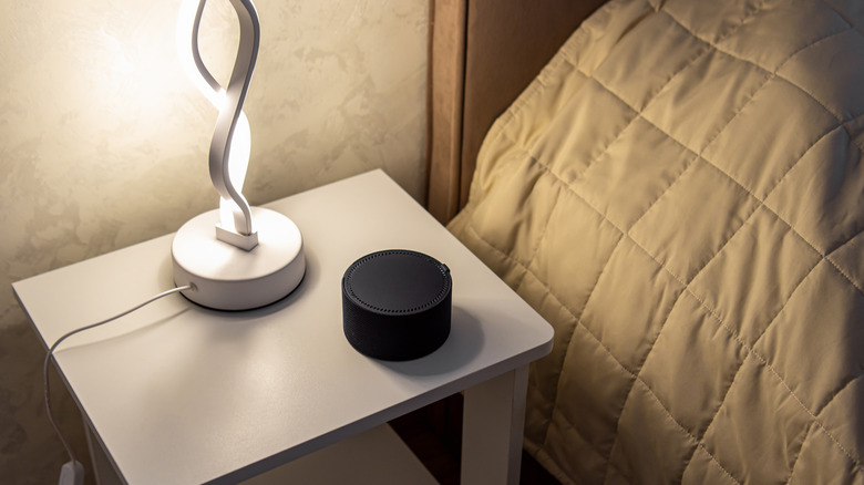 Smart speaker on bedside table in bedroom