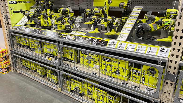 A Home Depot store shelf filled with Ryobi tools