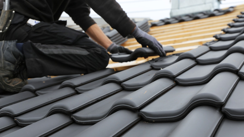 Person installing new roof