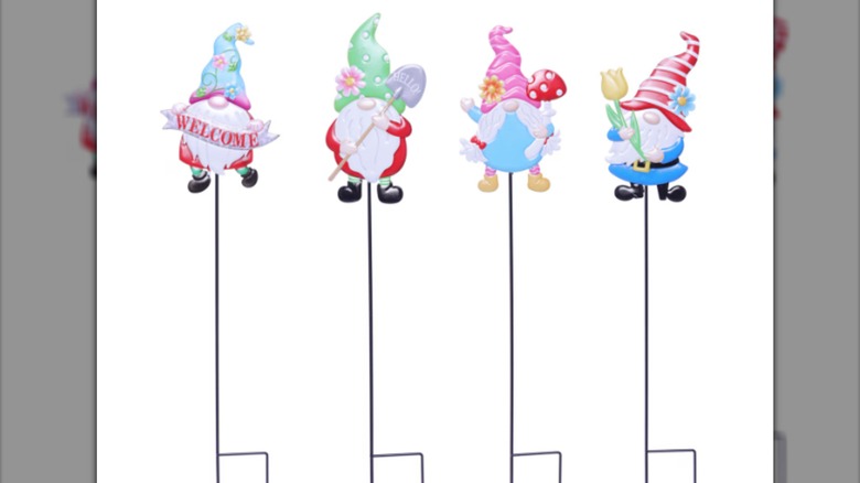 Garden stakes themed with spring-themed gnomes