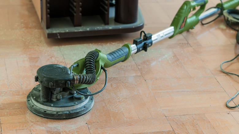 a floor sander on a hardwood floor