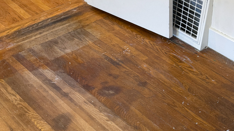 hardwood floor with various stains