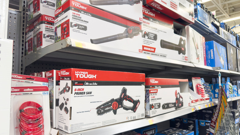 Hyper Tough saws and other power tools on shelves at Walmart.