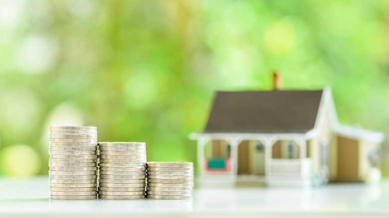 coins and house stock image