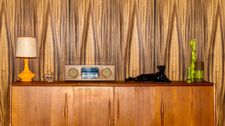 Wood paneled wall with dresser