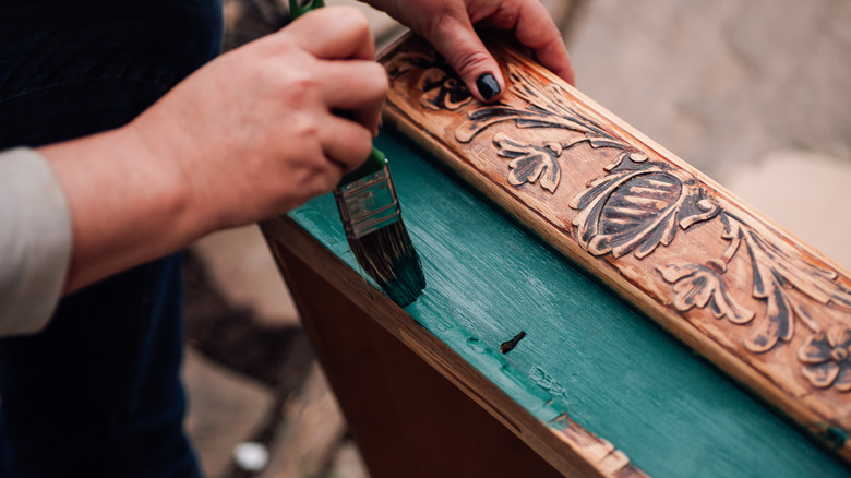 someone's painting an antique