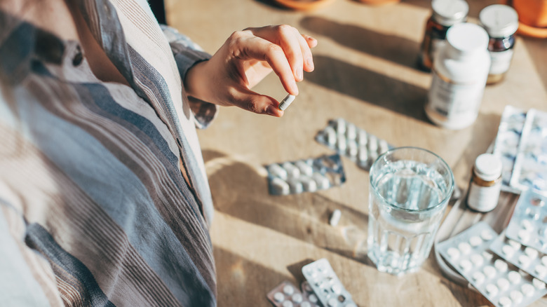 Person sorting through medications