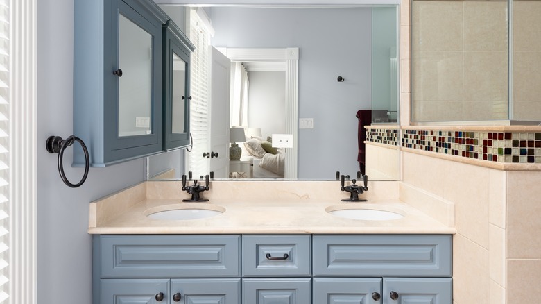 Sleek bathroom with a wall cabinet and drawers