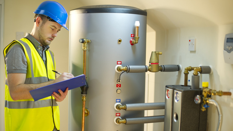 Man inspects home furnace