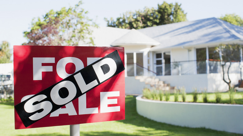 house with sold sign