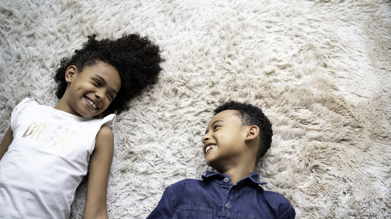 Children playing on carpet