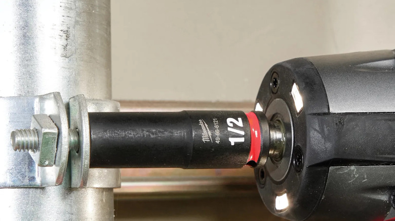 A heavy-duty Milwaukee Shockwave socket on an impact wrench