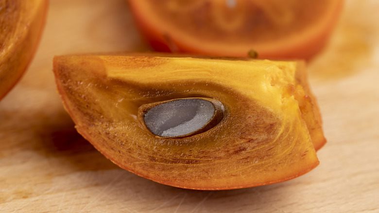Sliced persimmon with seed inside
