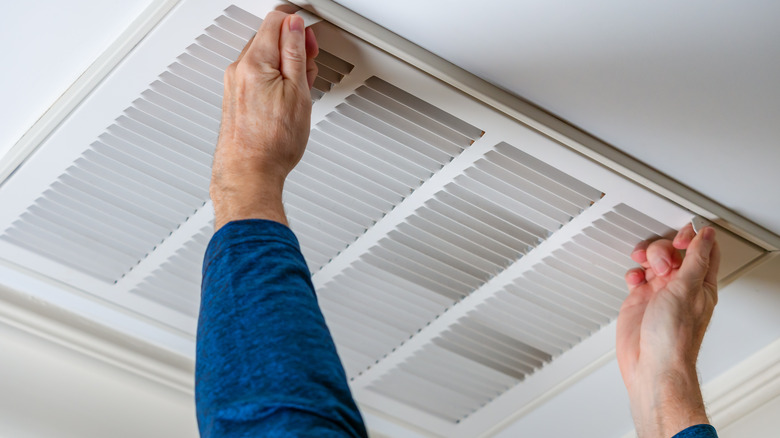 person removing air vents