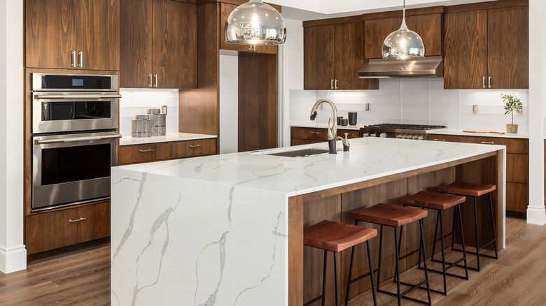 Kitchen with dark wood cabinets 