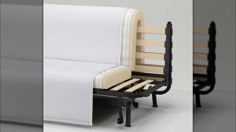 The frame and mattress layers of IKEA's LYCKSELE LÖVÅS are shown in a detail shot