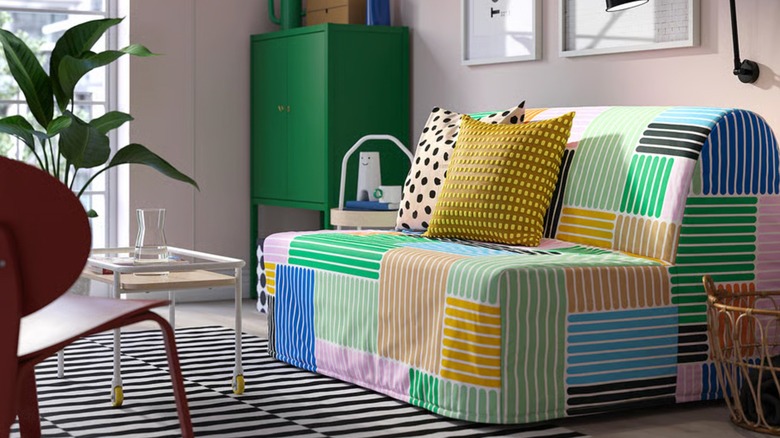 An IKEA LYCKSELE LÖVÅS sleeper sofa sits in a neutral living room