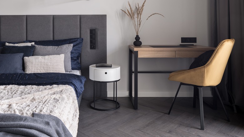 gray wood flooring in bedroom