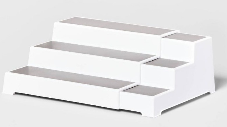 Expandable 3-tier shelf on white background