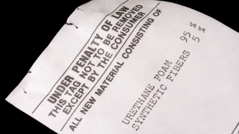 Closeup of the tag that is required on new mattresses