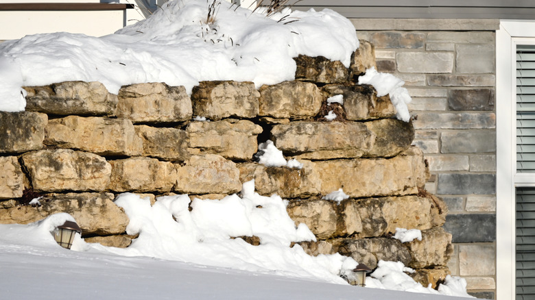 Retaining wall covered in snow