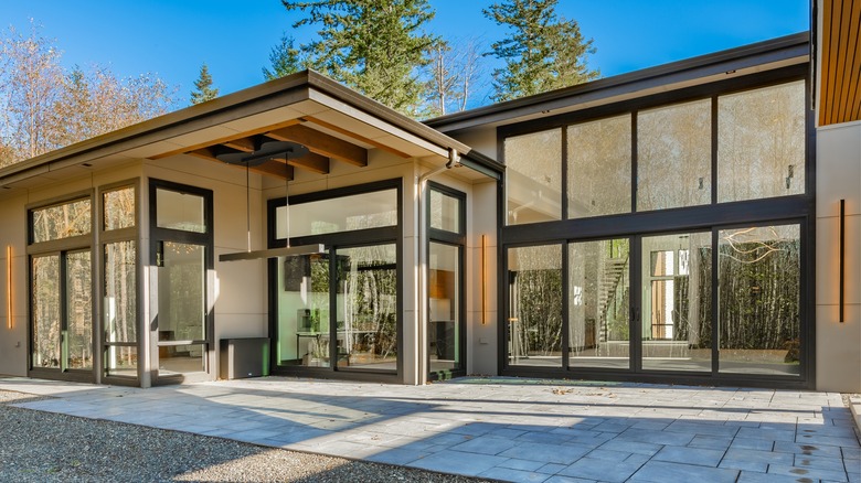 A modern home with large windows and a flat roof