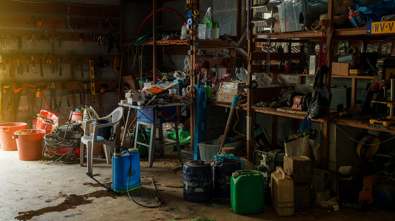 gardening supplies in messy garage