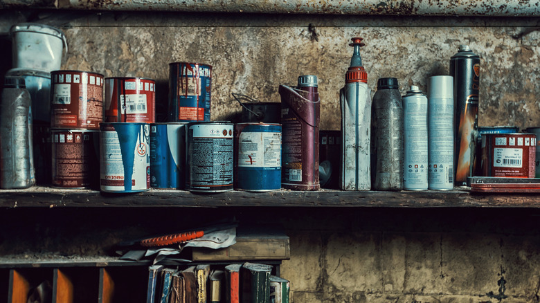 garage shelf with paints and supplies