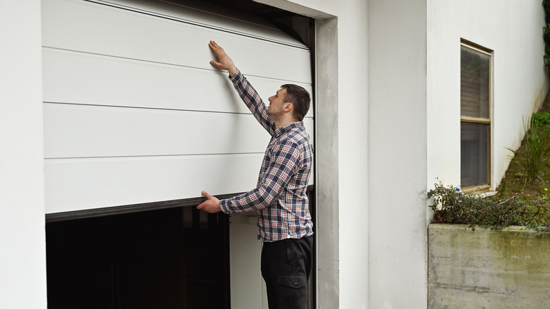 person opening garage door