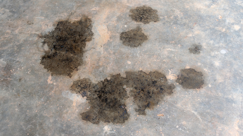 spilled oil on concrete floor