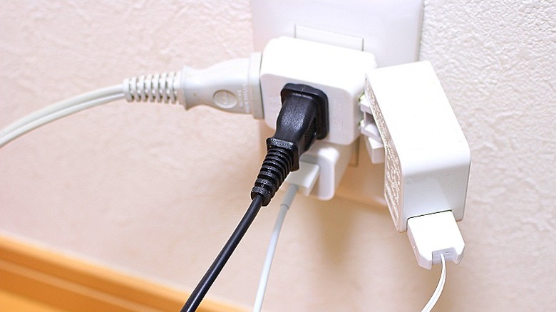 Overloaded outlet with electrical cords