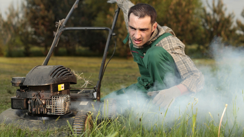 Excess smoke coming from a worn lawnmower engine