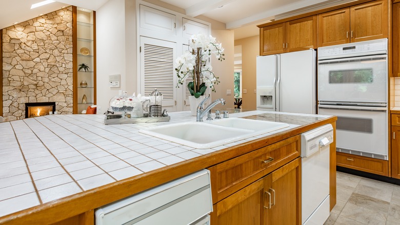 kitchen with white tile countertops