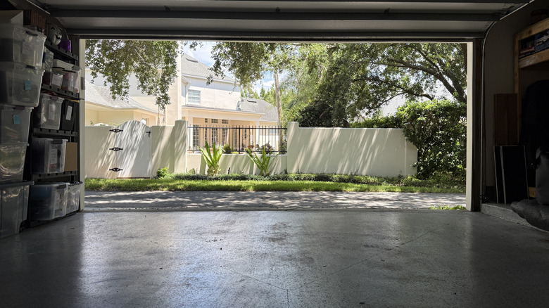 Garage with open door looking out at neighborhood