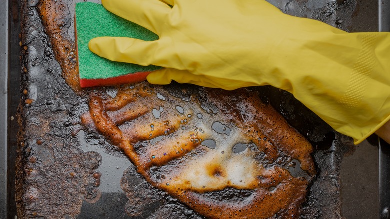 Cleaning out the bottom of a grill