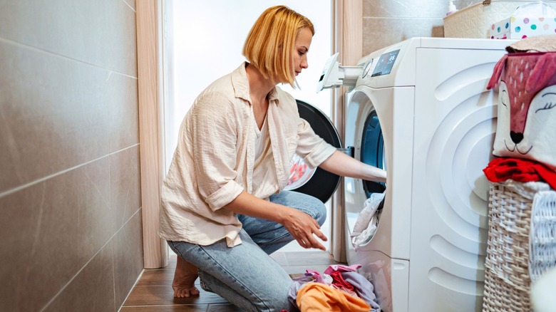 Sorting clothes in a laundry room