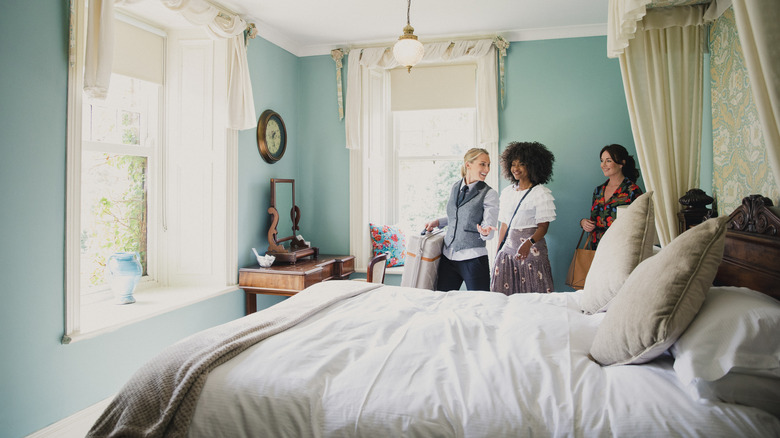 Women in guest bedroom