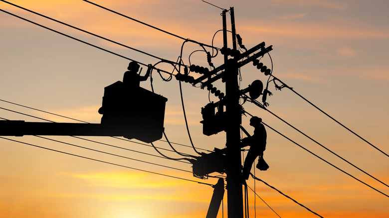 Utility workers doing work on power lines