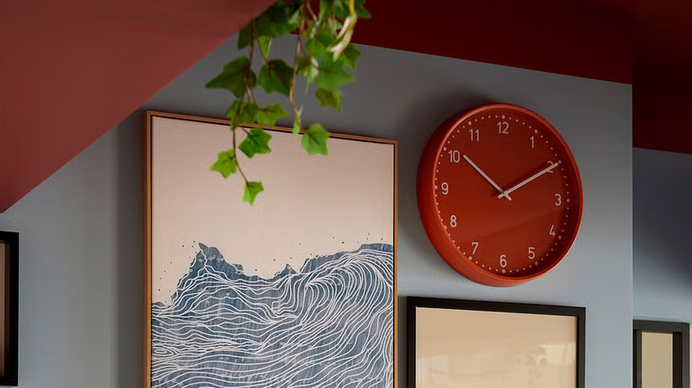 orange IKEA clock on wall