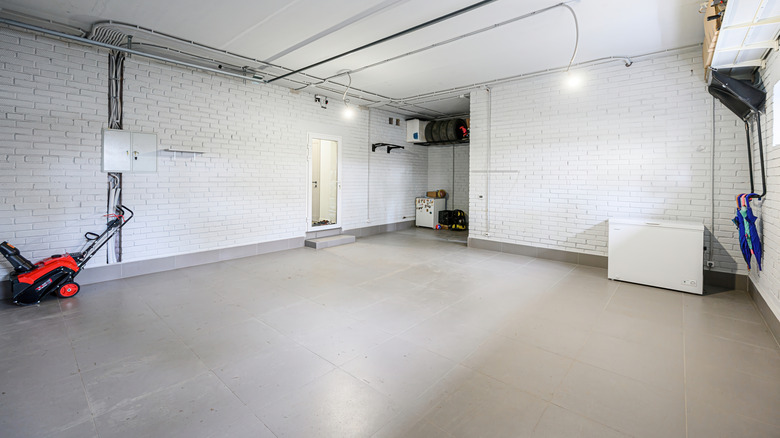 The inside of a garage with concrete flooring