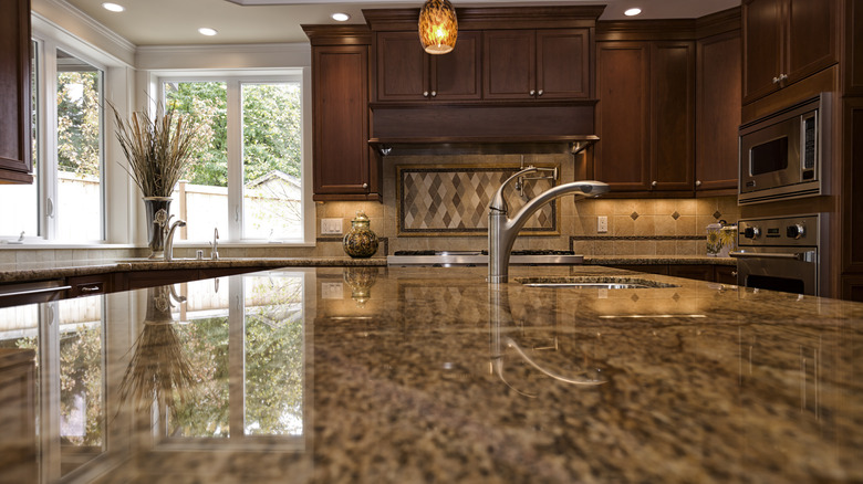 person cleaning kitchen counter