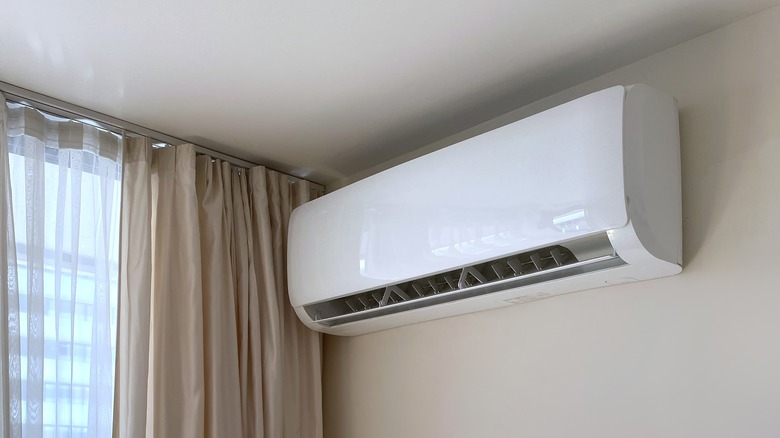 Mini split on the wall in a house's corner