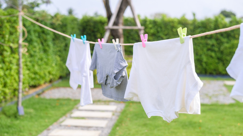 Clothes are hanging on a laundry line outside