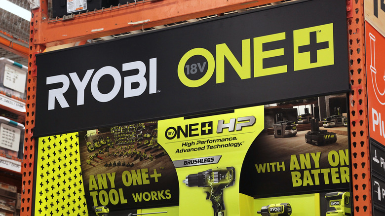 Ryobi ONE+ power tool display at hardware retailer.