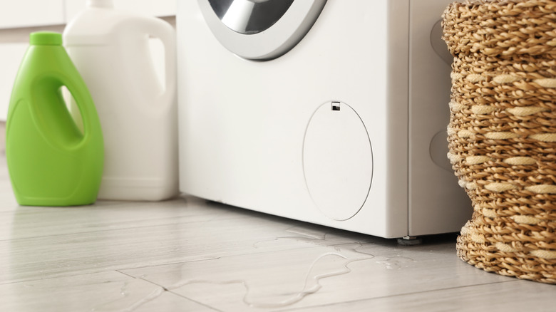 Water leaking from beneath a washing machine