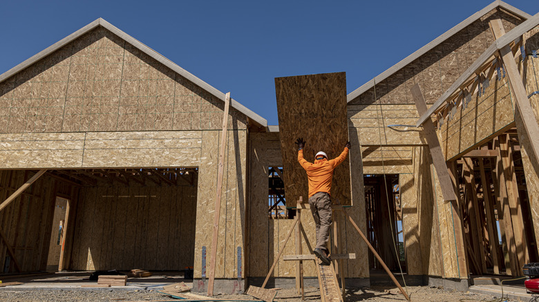 man working on house construction