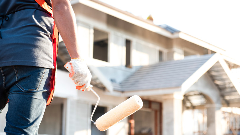 house painter holding roller